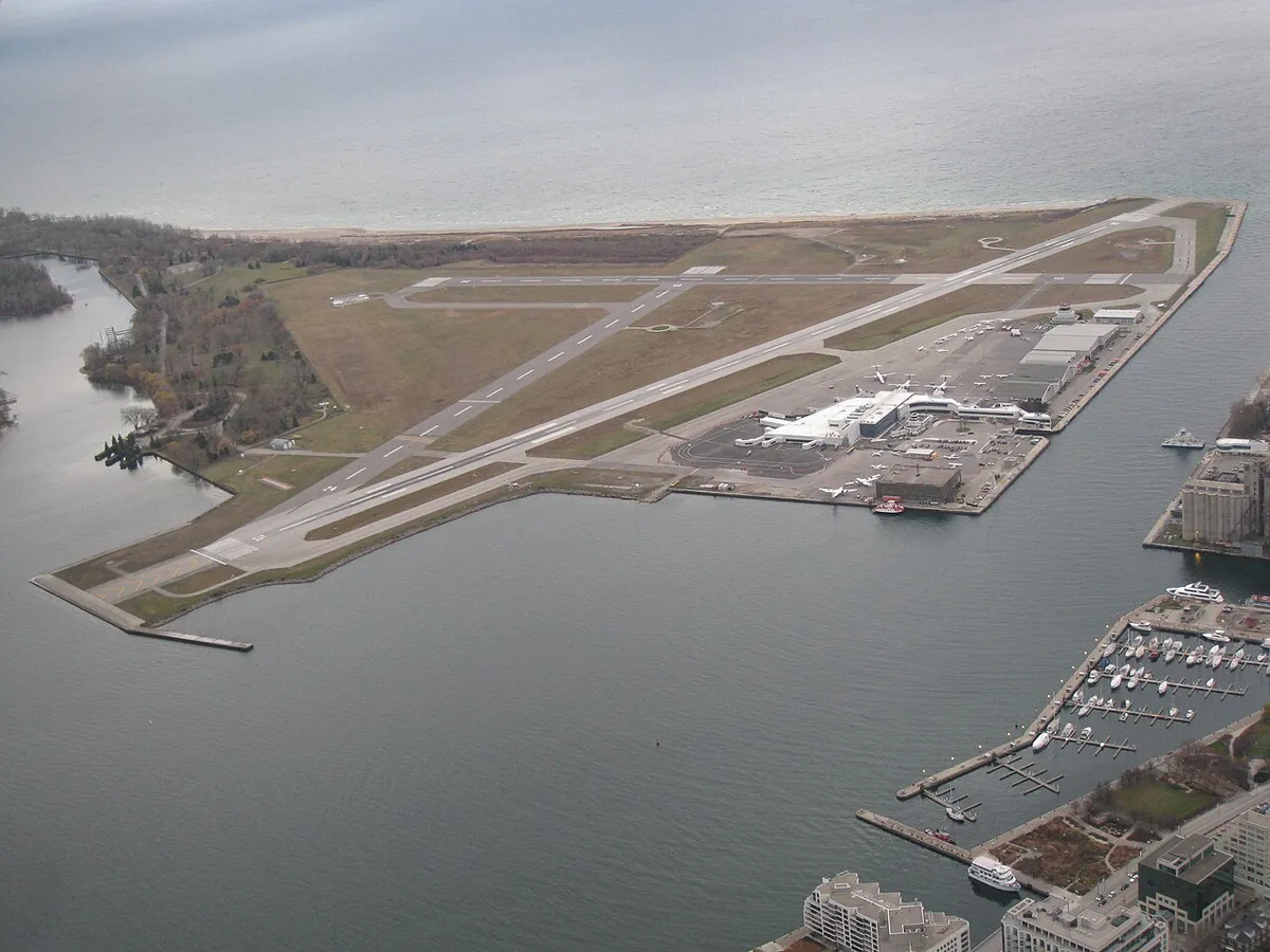 Aerial view of Billy Bishop Toronto City Airport from the CN Tower, showing the island runway and Toronto harbour