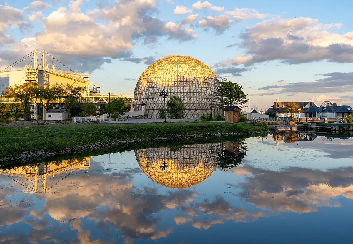 The Cinesphere at Ontario Place reflected in the water at sunset