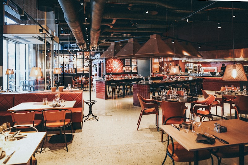 Vintage steakhouse dining room with red leather banquettes