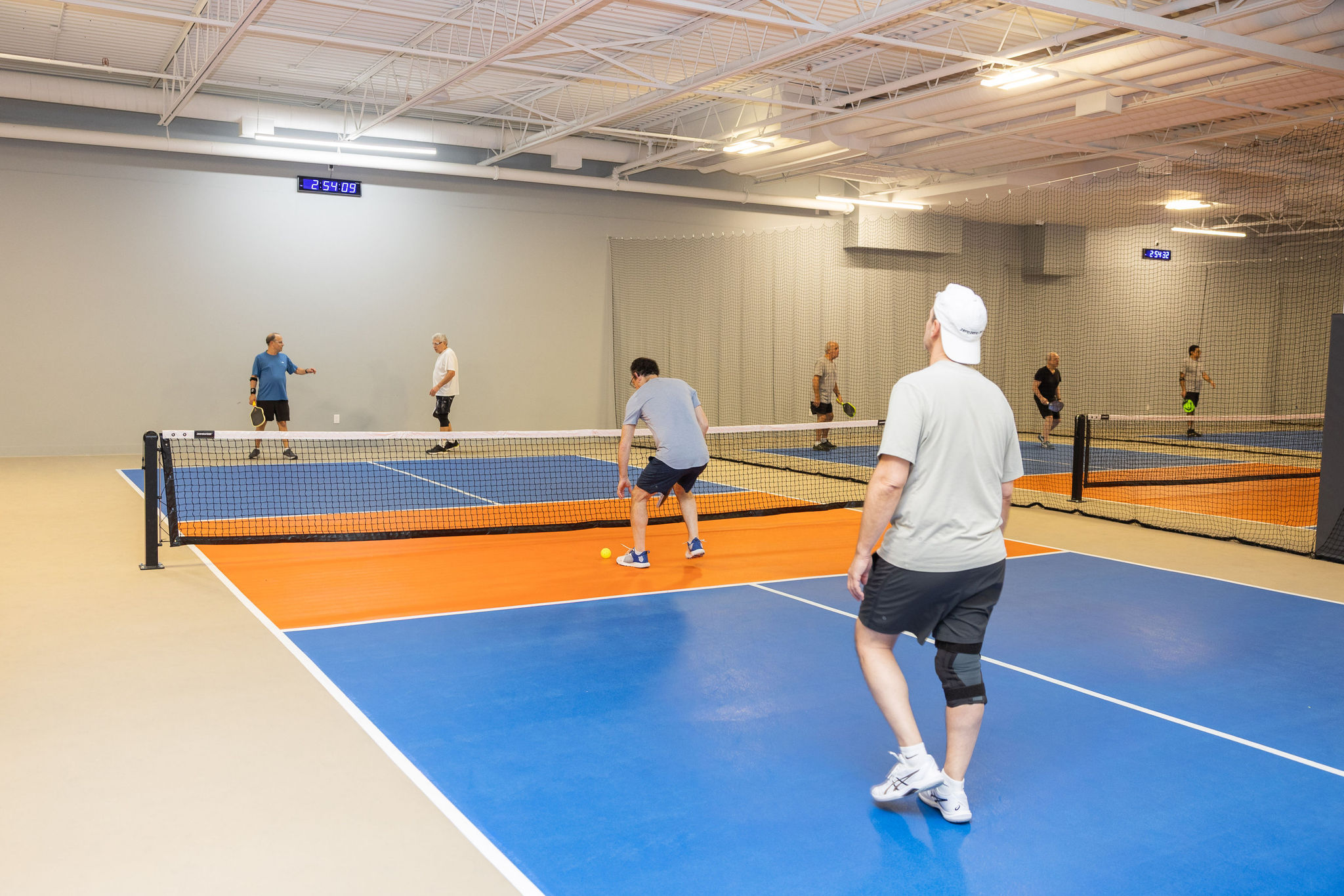 Indoor courts at JEM PicklePlace social club on Dufferin Street