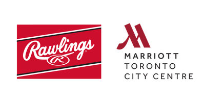 The Rawlings Room suite featuring a dugout-style headboard, baseball-themed decor, and a direct view of the Rogers Centre field through floor-to-ceiling windows.