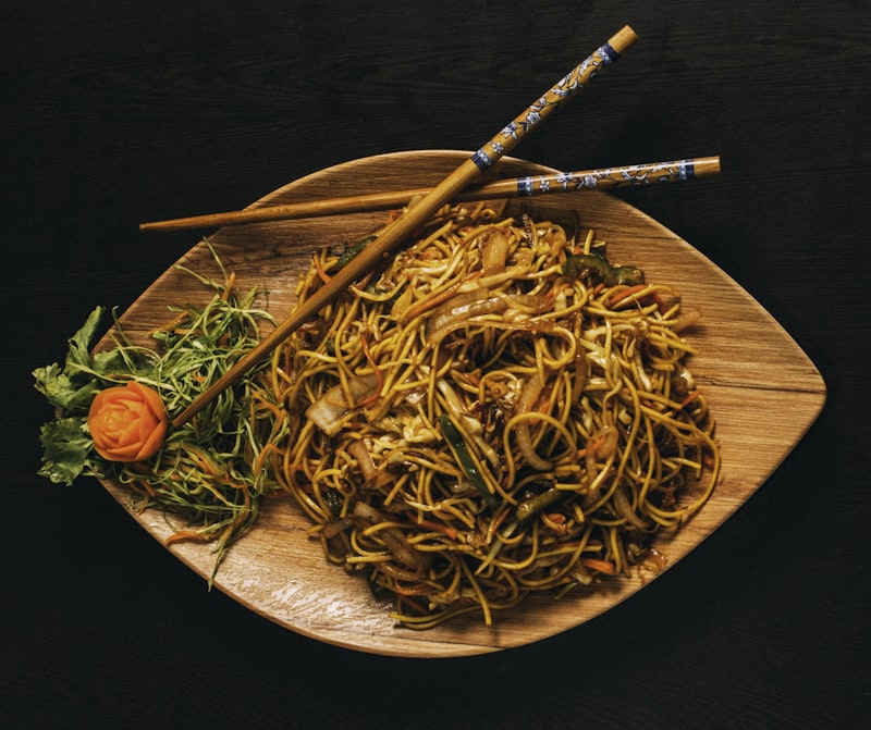 Vibrant Indonesian dishes with sambal condiments on a rustic table