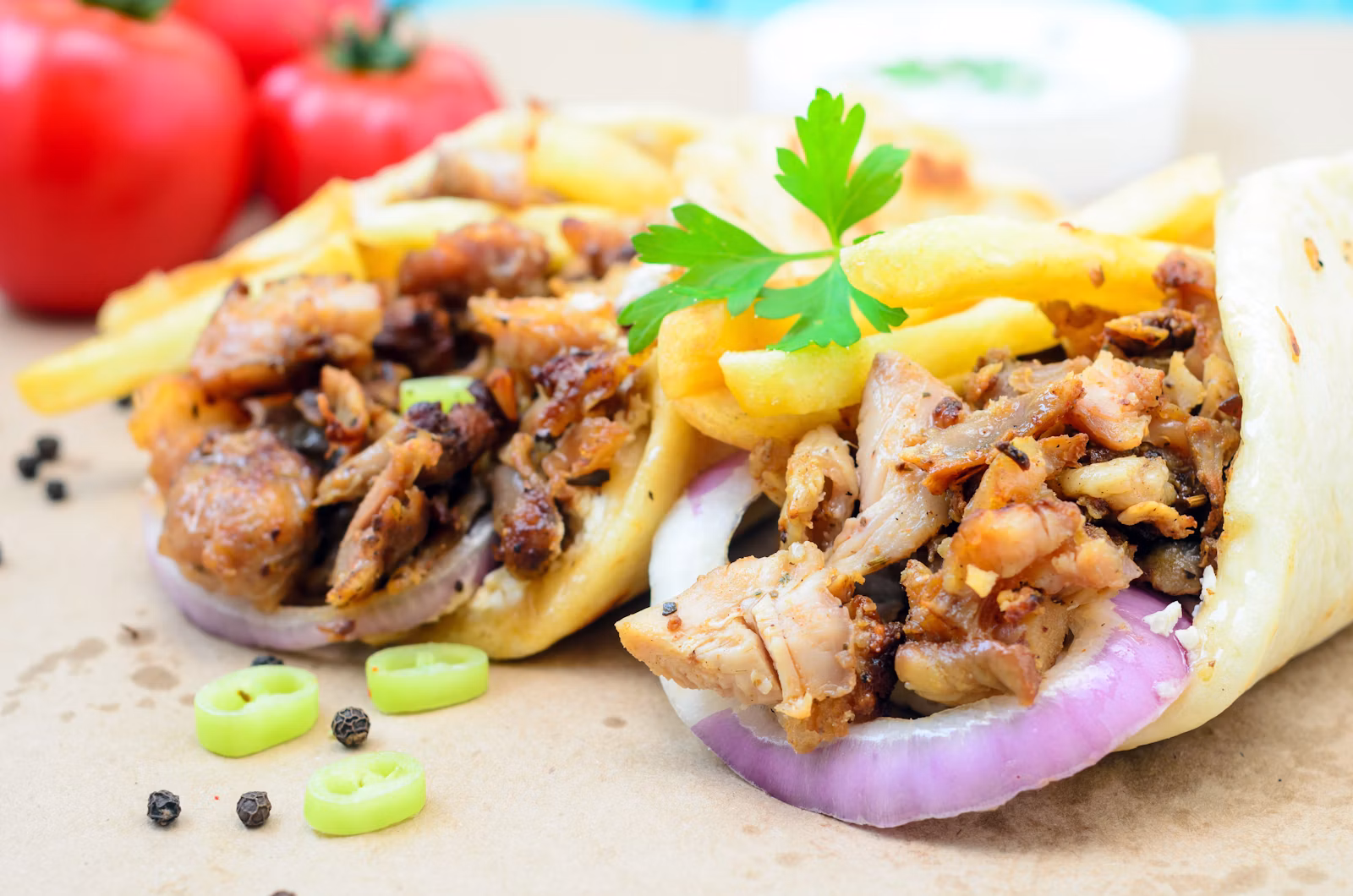 Shawarma-style spit meat photography (Unsplash placeholder — no official venue photo)