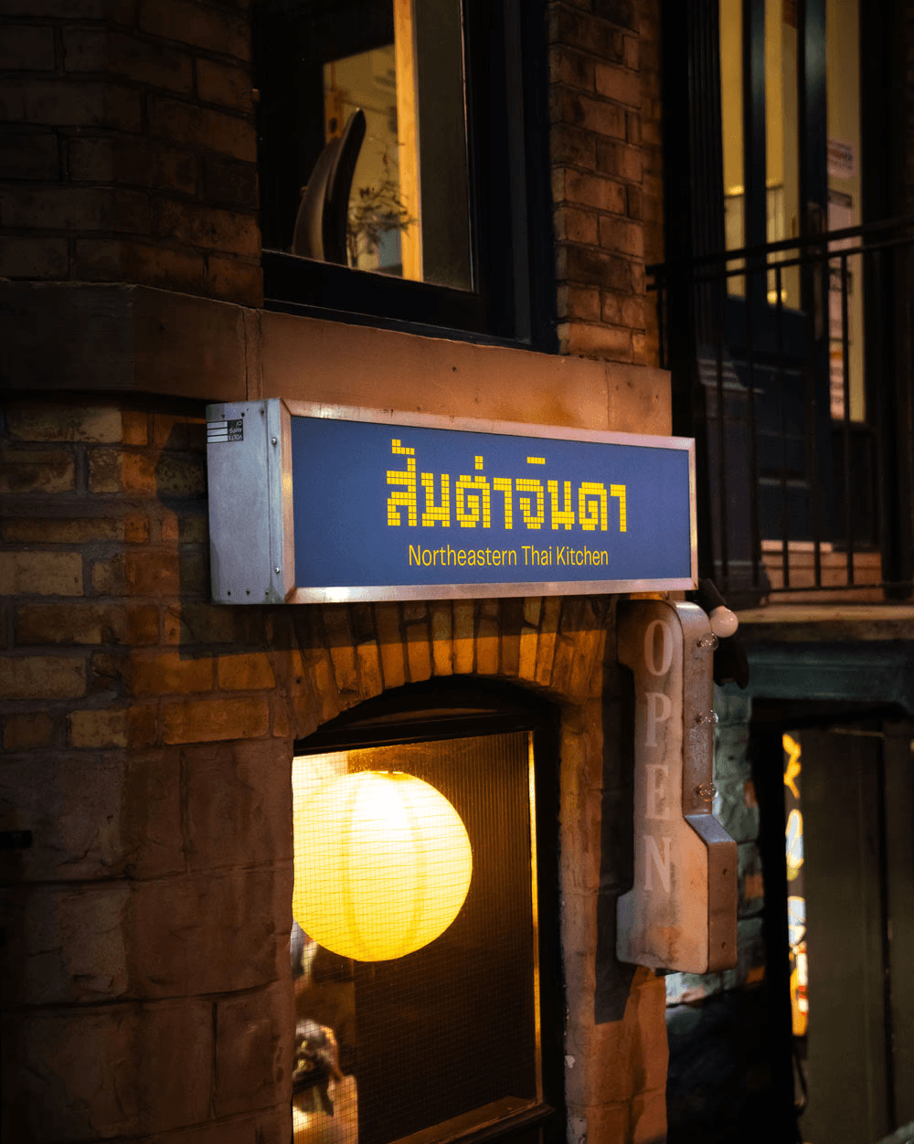 Somtum Jinda’s illuminated northeastern Thai kitchen sign at its Gerrard Street entrance, from the official branch directory