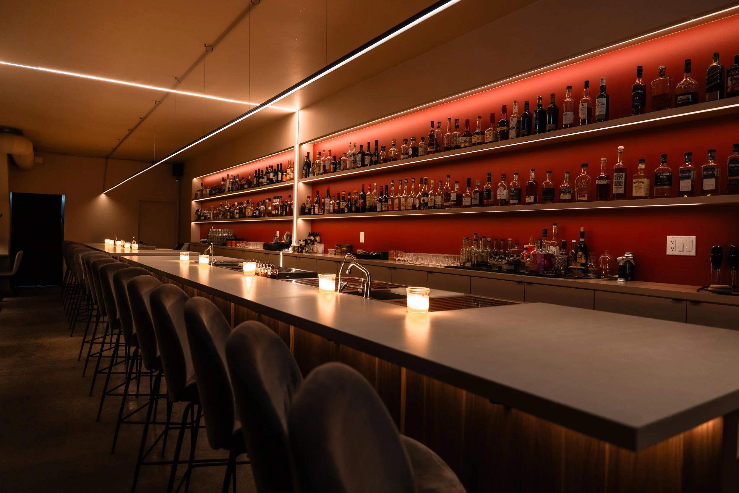The long bar inside Suite 115, from the official Squarespace site