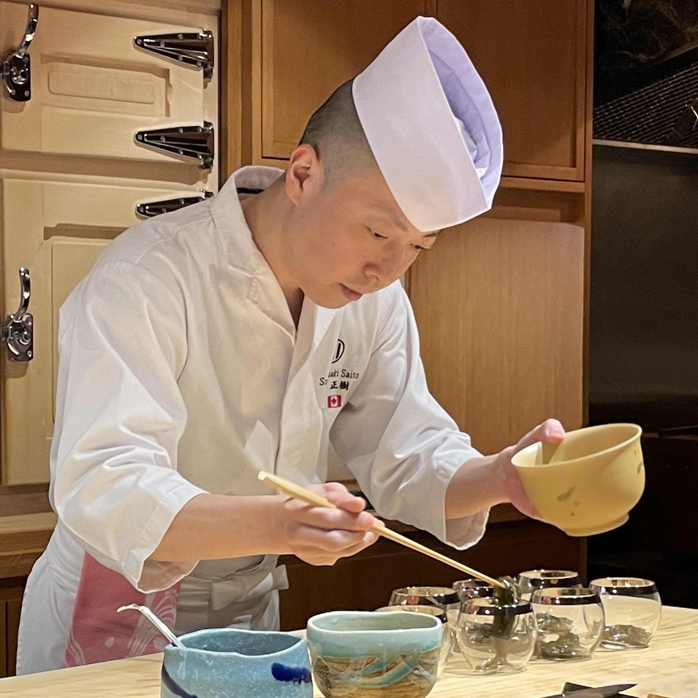 Chef Masaki Saito at the Yorkville hinoki counter (Wikimedia, Bobak Ha'Eri, 6 June 2024)