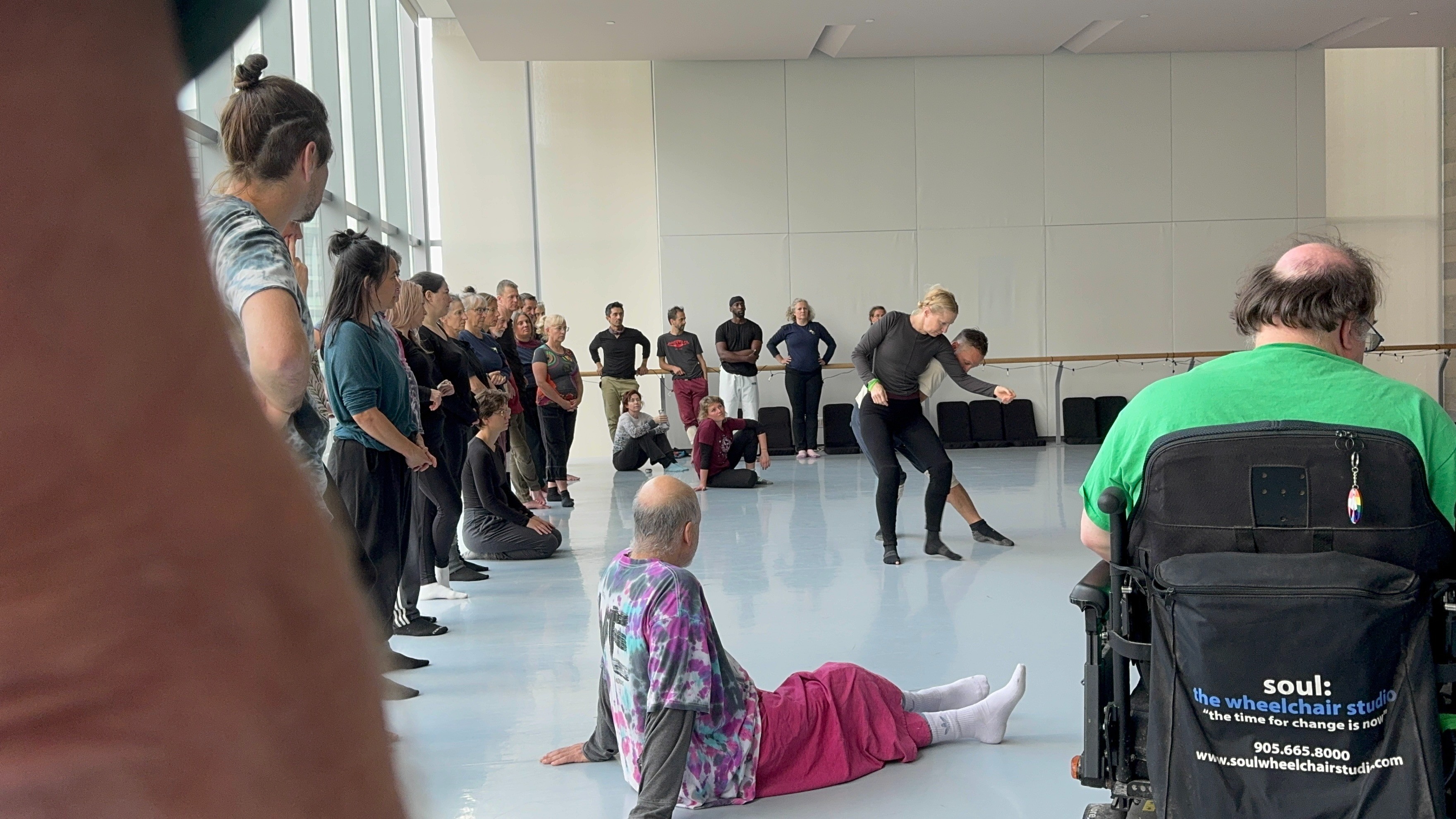 Dancers practicing contact improvisation in a studio