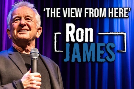 Comedian Ron James performing on stage