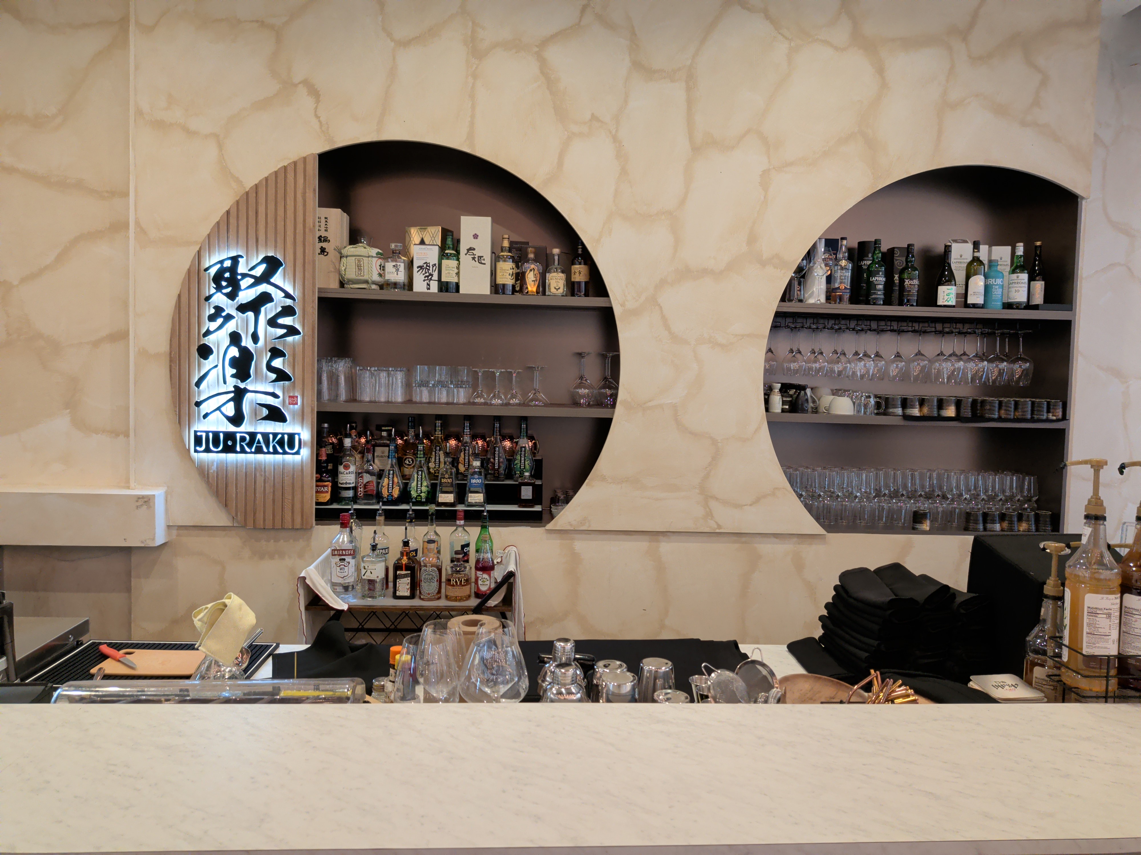 A view of the bar area with circular shelving