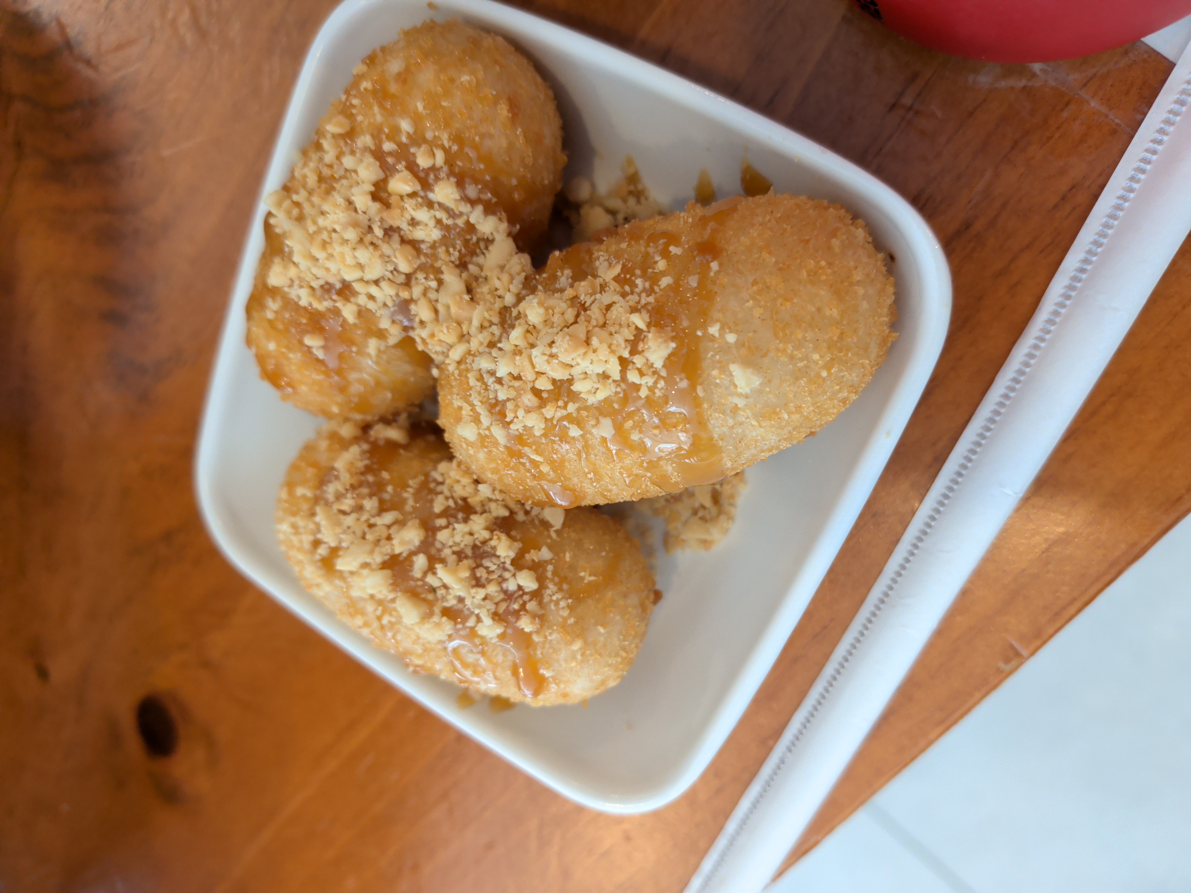 Crispy mochi with salted caramel and crushed peanuts